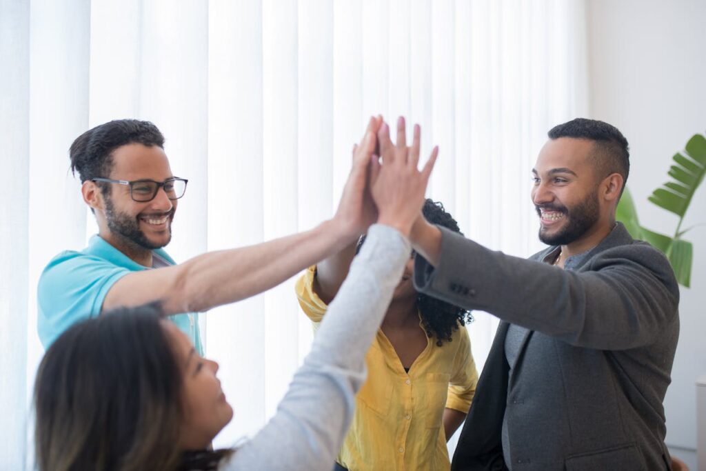 Group of Men and Women Doing High Five